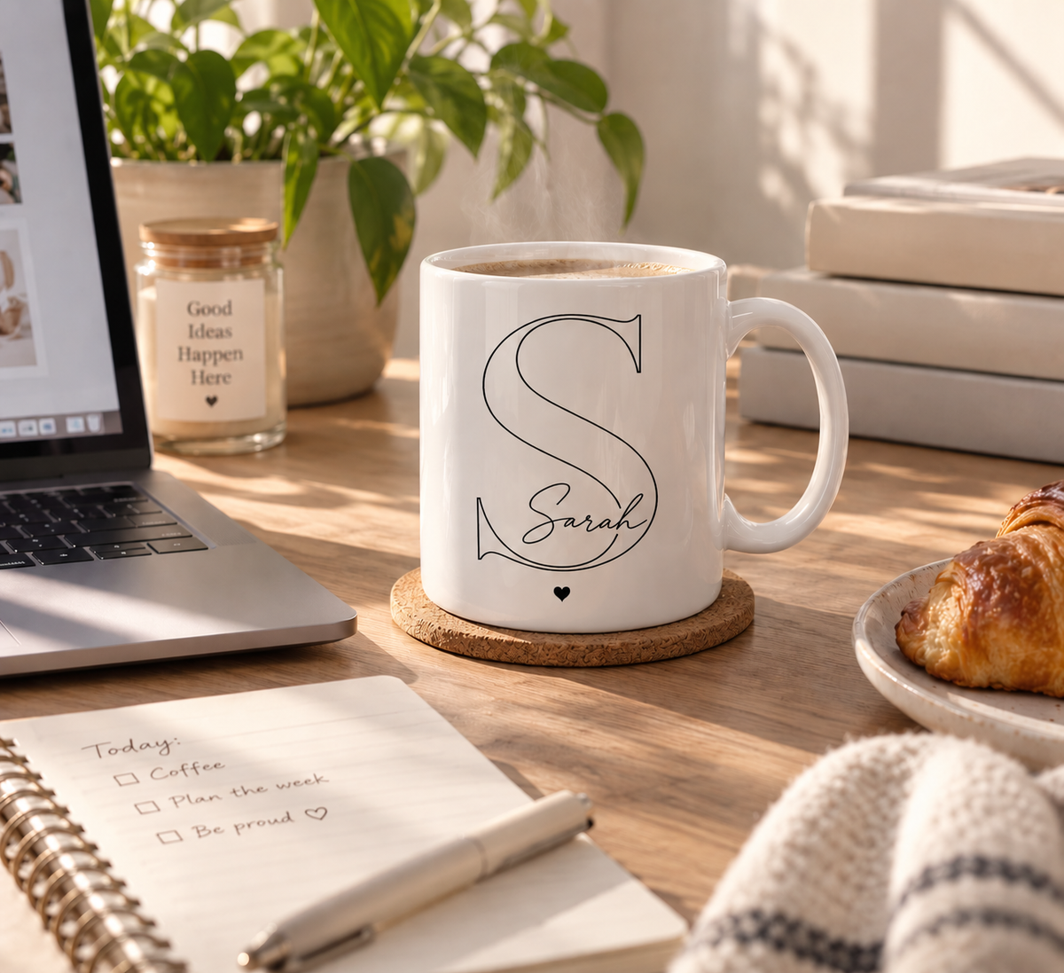 Custom initial and name mug held in cozy home setting