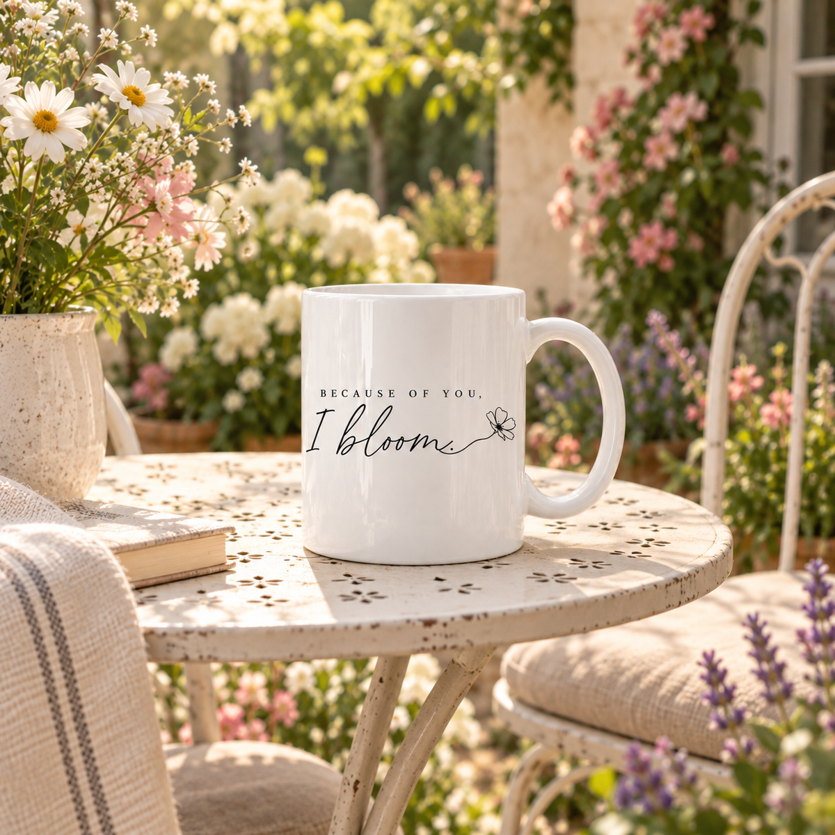 Because of You I Bloom mug with floral design in a sunny flower garden setting

